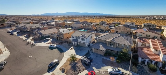 birds eye view of property with a mountain view