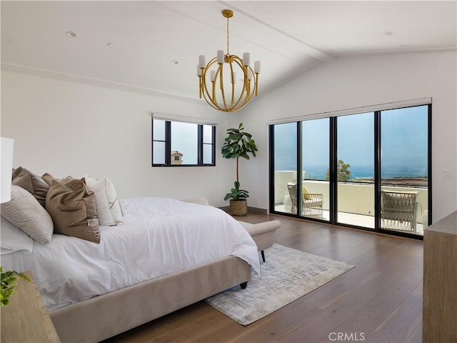 bedroom with vaulted ceiling, a chandelier, a water view, dark wood-type flooring, and access to exterior