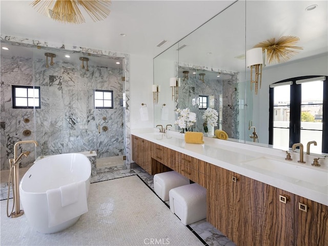 bathroom featuring separate shower and tub and vanity