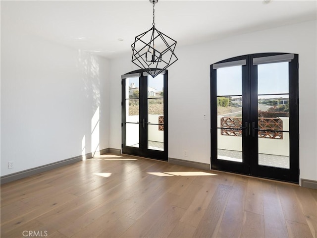 doorway to outside featuring french doors and wood-type flooring