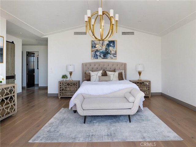 bedroom featuring dark wood-type flooring, vaulted ceiling, a chandelier, a barn door, and crown molding