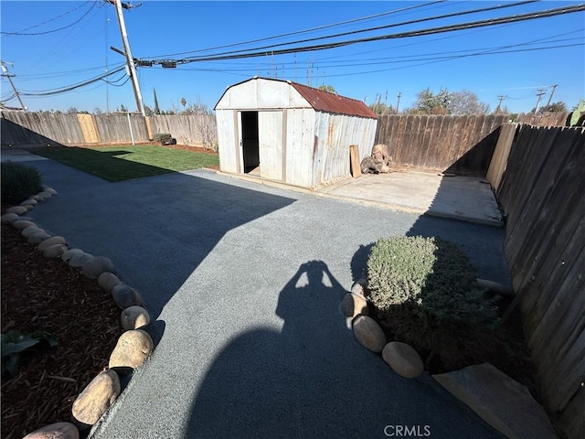 view of yard with a patio and a shed