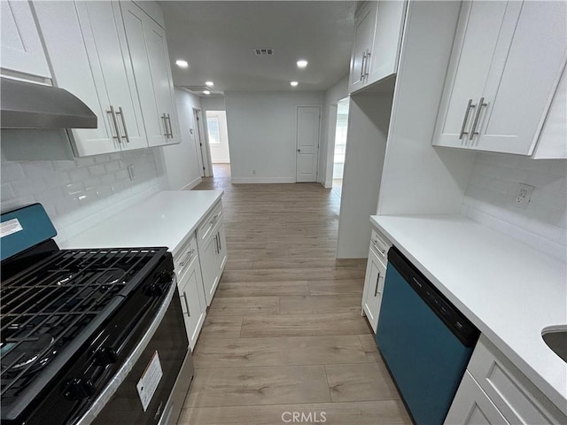 kitchen with gas range, light wood-type flooring, dishwasher, and white cabinetry