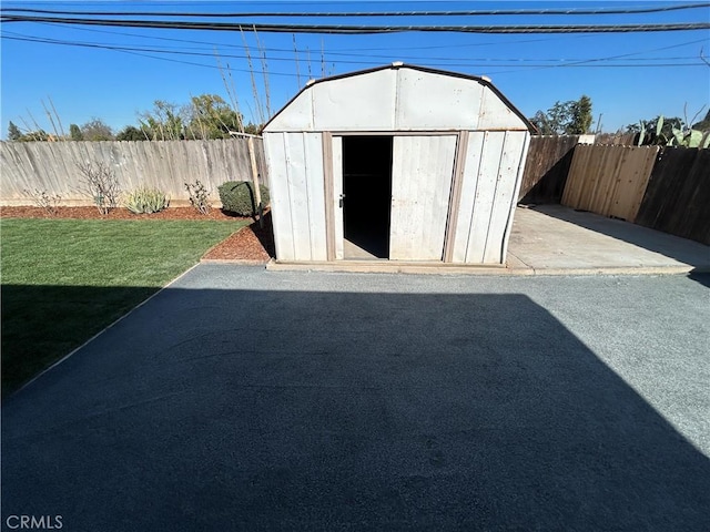 view of outbuilding with a lawn