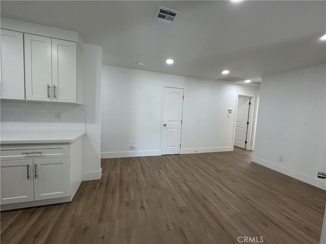 interior space with dark hardwood / wood-style flooring