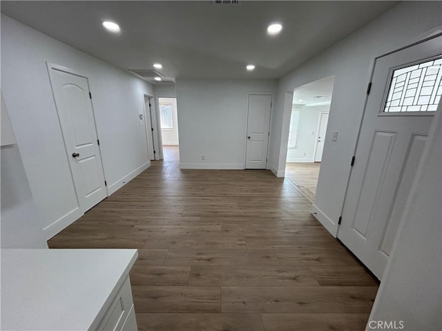 corridor featuring wood-type flooring