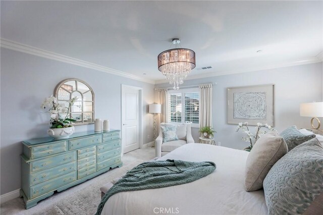 bedroom featuring light colored carpet, a chandelier, and ornamental molding