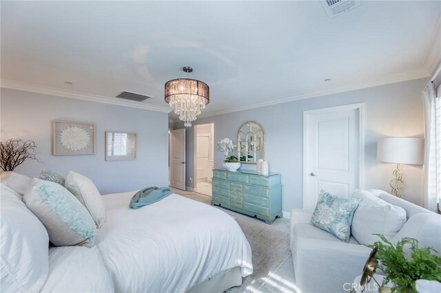 bedroom with ornamental molding and an inviting chandelier