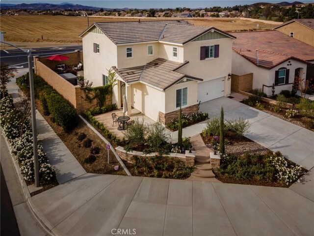 view of front of property featuring a mountain view and a garage