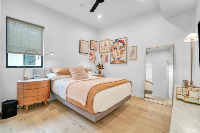 bedroom with ceiling fan and light hardwood / wood-style flooring