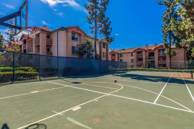 view of sport court featuring tennis court