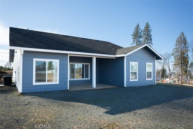 back of property featuring cooling unit and a patio area