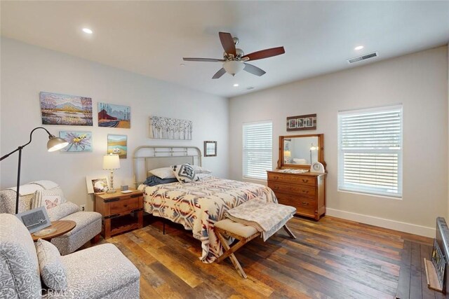 bedroom featuring ceiling fan and dark hardwood / wood-style floors