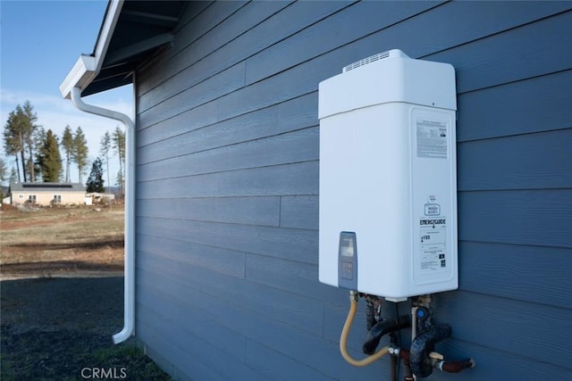 view of side of home with tankless water heater