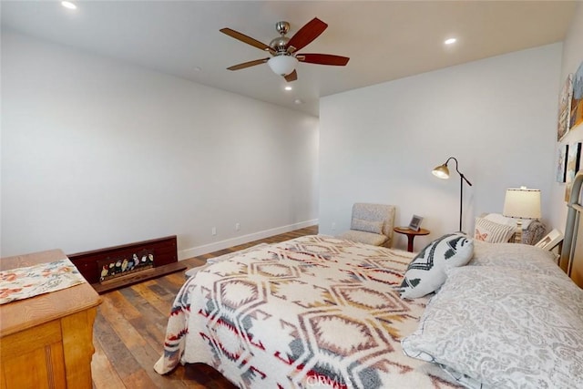 bedroom featuring dark wood-type flooring and ceiling fan