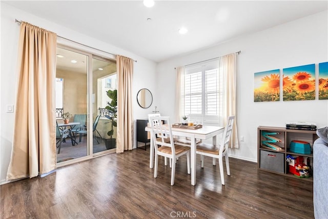 dining area featuring dark hardwood / wood-style floors