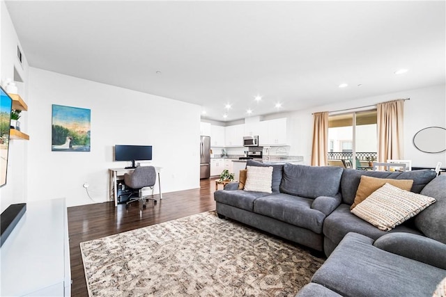 living room with dark hardwood / wood-style floors