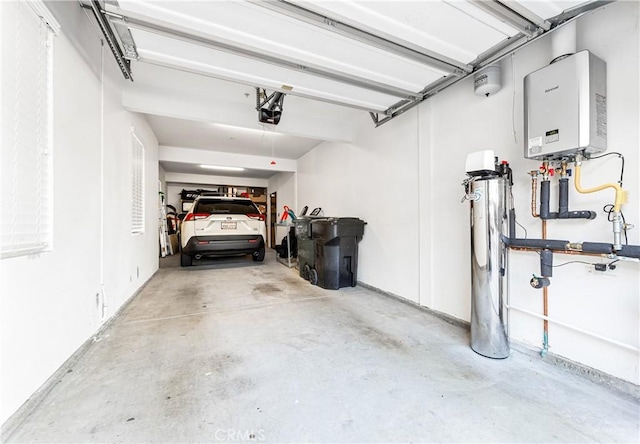 garage featuring a garage door opener and water heater