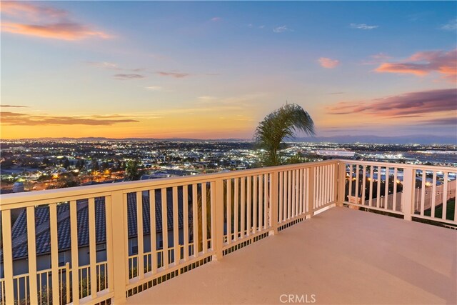 view of balcony at dusk