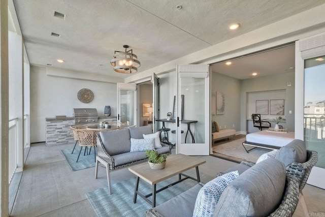 living room featuring a notable chandelier