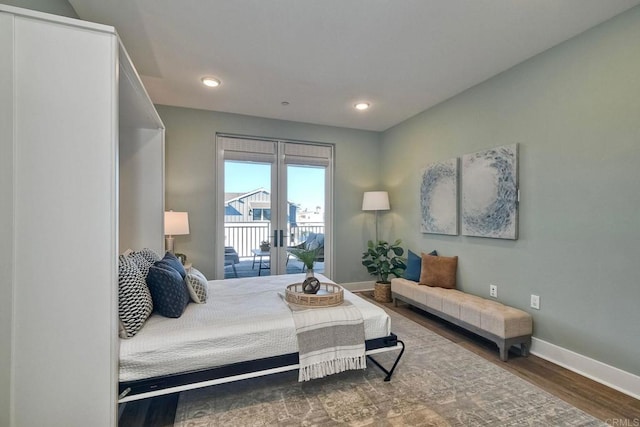 bedroom featuring access to outside and hardwood / wood-style floors