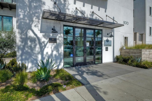 property entrance featuring french doors