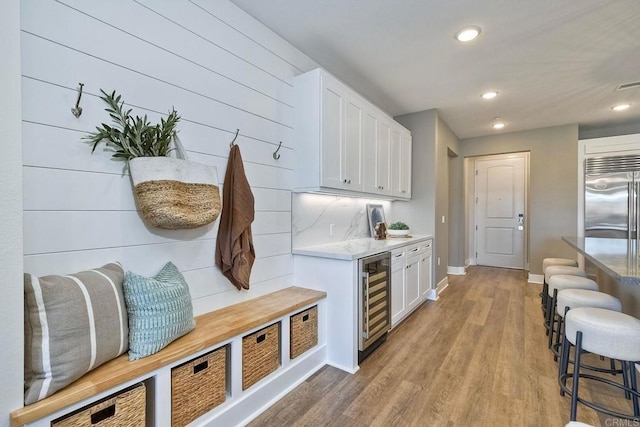 interior space featuring beverage cooler and light wood-type flooring