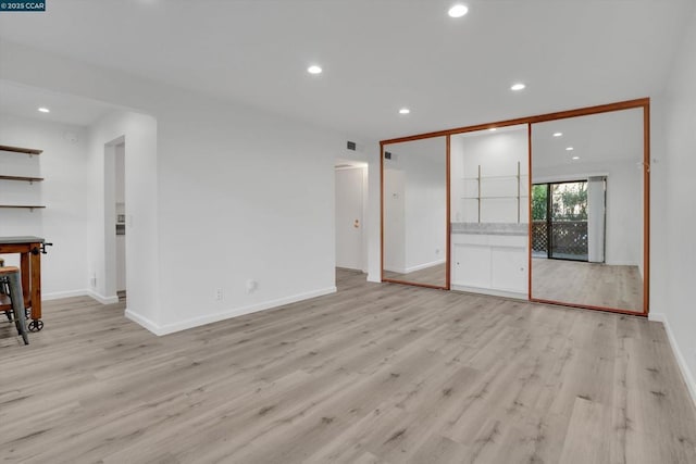 unfurnished living room with light hardwood / wood-style floors