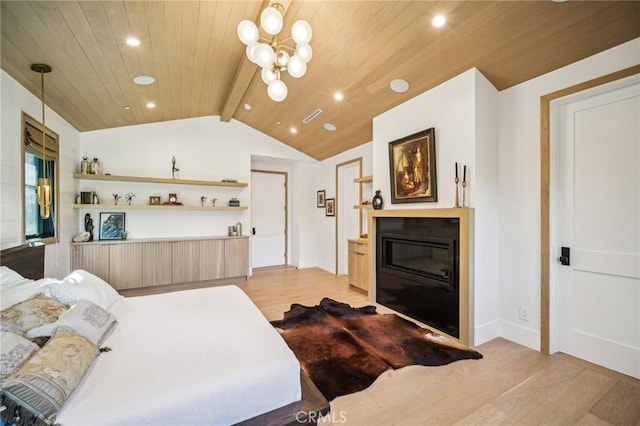 bedroom featuring lofted ceiling with beams, light hardwood / wood-style flooring, a notable chandelier, and wood ceiling