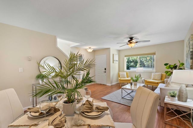 living room with ceiling fan and wood-type flooring