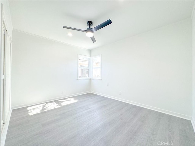 unfurnished room with ceiling fan and light hardwood / wood-style flooring