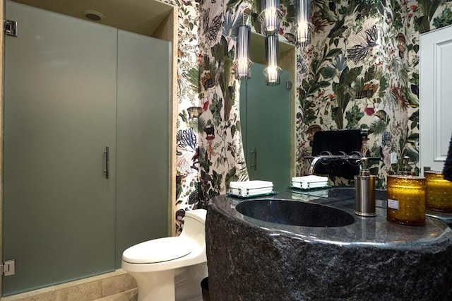 bathroom with sink, tile patterned floors, and toilet