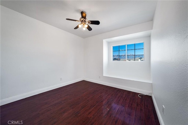 empty room with ceiling fan and hardwood / wood-style floors