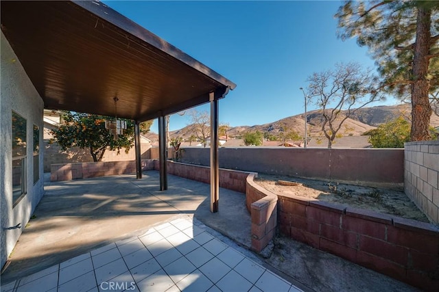 view of patio / terrace with a mountain view