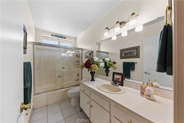 full bathroom with toilet, tile patterned floors, vanity, and enclosed tub / shower combo