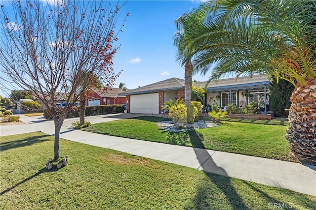 ranch-style house featuring a front yard and a garage