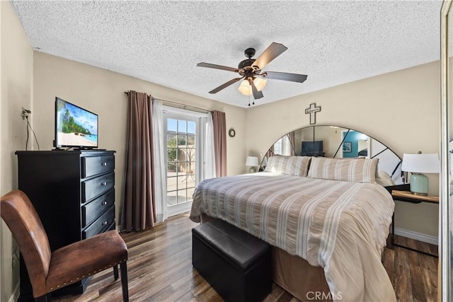 bedroom with a textured ceiling, access to exterior, ceiling fan, and hardwood / wood-style flooring