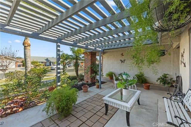 view of patio featuring a pergola