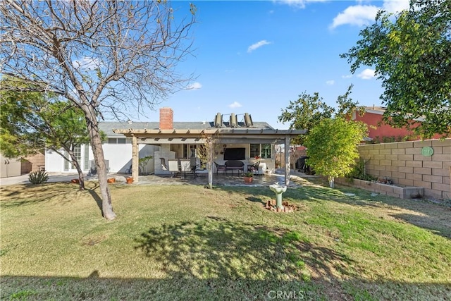 rear view of property with a patio and a yard