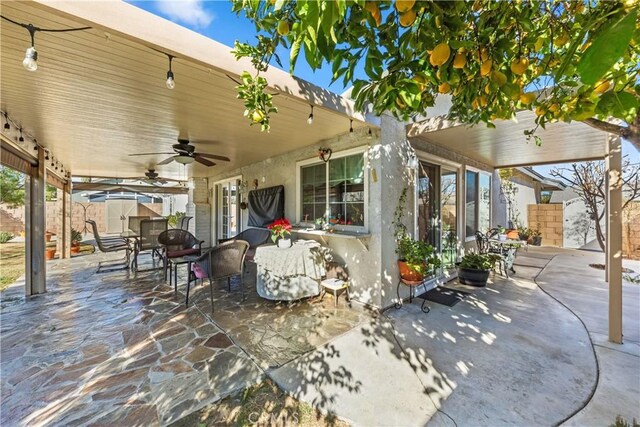 view of patio / terrace featuring ceiling fan