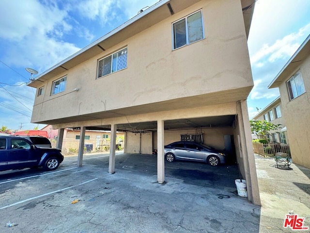 view of parking featuring a carport