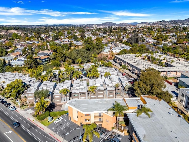 drone / aerial view featuring a residential view and a mountain view