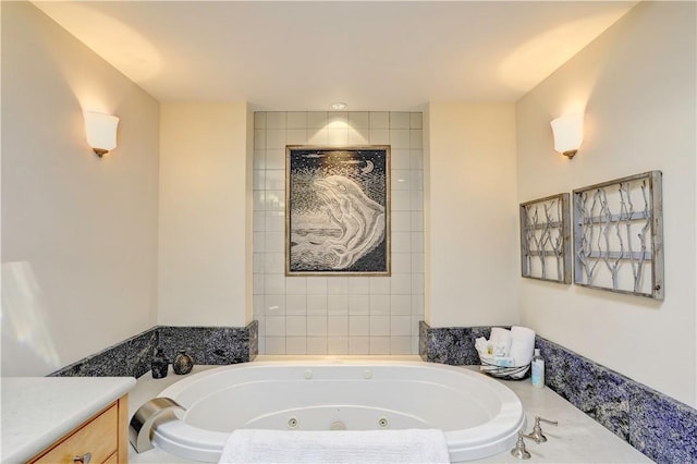 bathroom with vanity and a bath