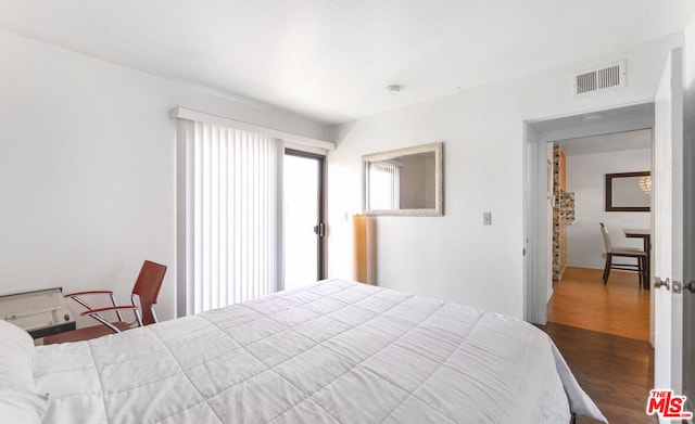 bedroom featuring dark hardwood / wood-style floors