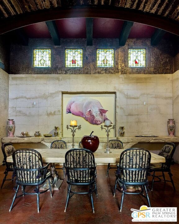 dining area featuring a wealth of natural light and beam ceiling