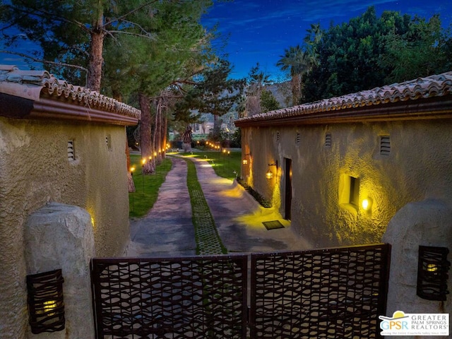 view of property exterior at twilight