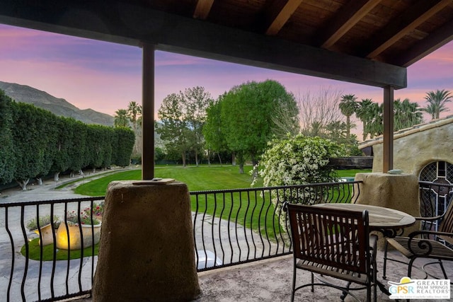 balcony at dusk with a mountain view