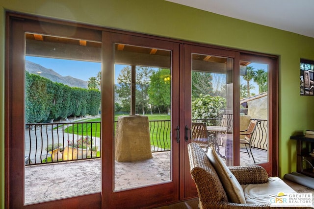 doorway to outside with a mountain view and french doors