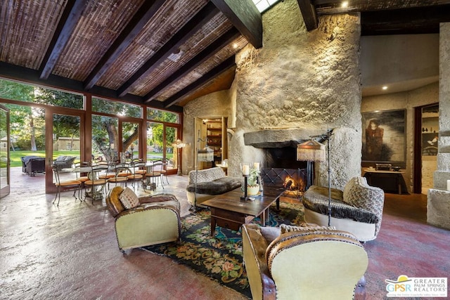 living room featuring high vaulted ceiling, beam ceiling, a stone fireplace, and wooden ceiling