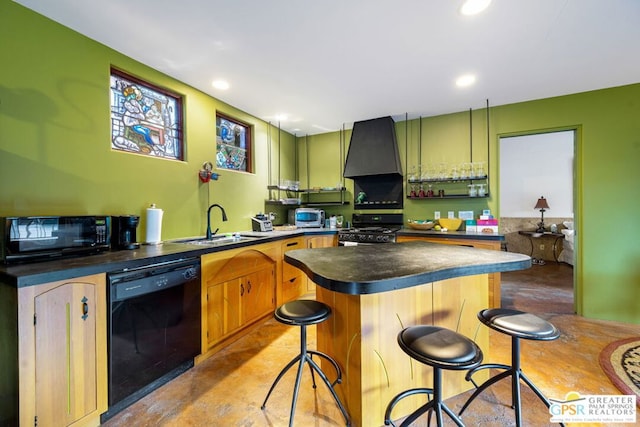 kitchen featuring premium range hood, a kitchen breakfast bar, a kitchen island, black appliances, and sink